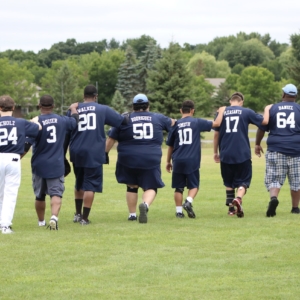 Kevin Daniel leads his Sluggers onto the field to get ready to play